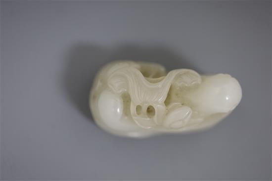 A Chinese white jade group of mandarin ducks, 19th/20th century, L. 4.8cm, wood stand